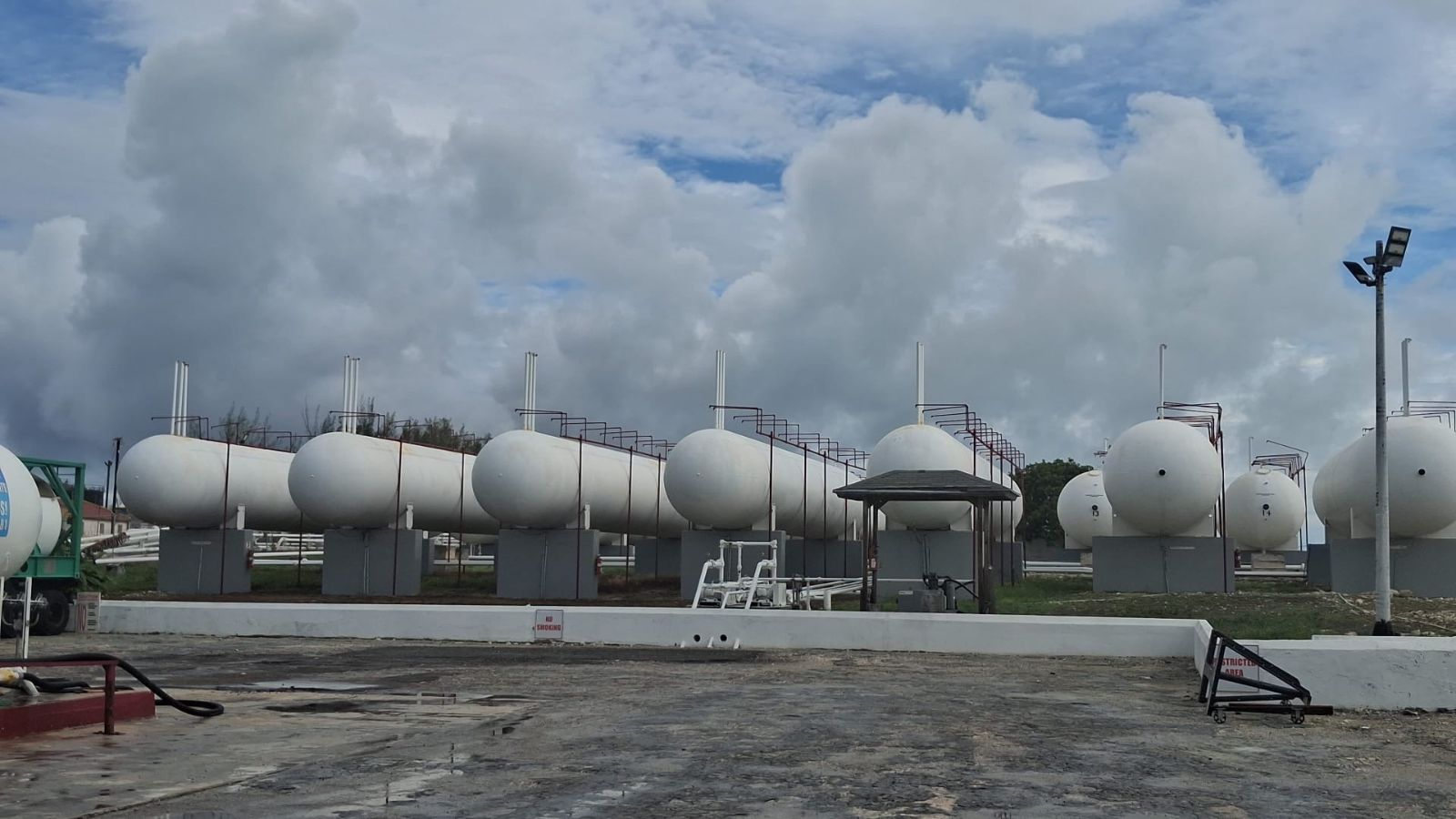Row of white LPG storage tanks at the Caribbean Gas bulk terminal, Clifton Pier